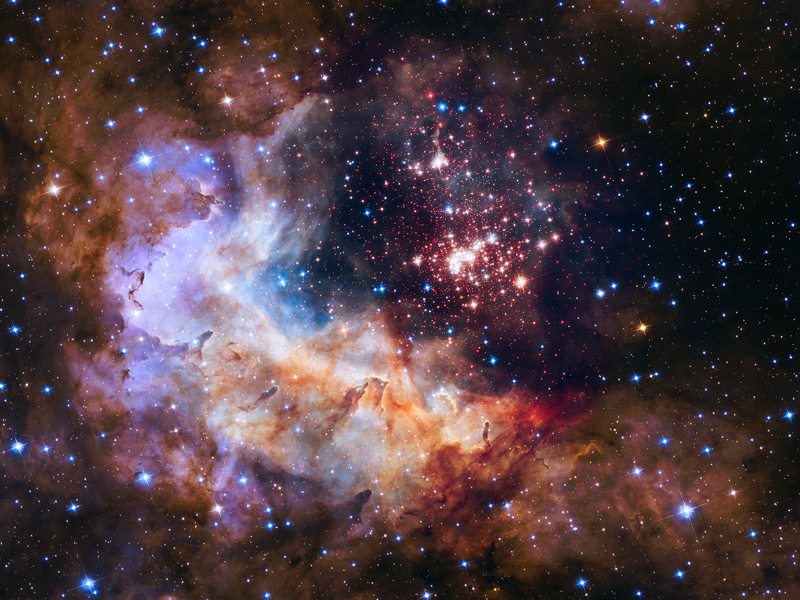 The brilliant tapestry of young stars flaring to life resemble a glittering fireworks display in the 25th anniversary NASA Hubble Space Telescope image, released to commemorate a quarter century of exploring the solar system and beyond since its launch on April 24, 1990.